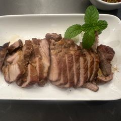 A picture of Kor Moo Yang - Thai Grilled Pork Neck.