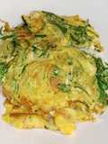 ไข่เจียวใส่ยอดผักกูด (Omelette with Young Fern Leaves)