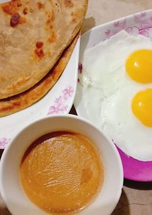 A picture of Desi Nashta (paratha,andha,chai).