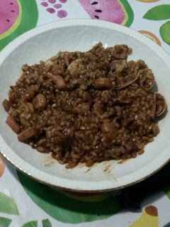 Una foto de Arroz negro a la cerveza