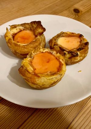 A picture of Portuguese custard tarts (natas)with blood orange caramel.