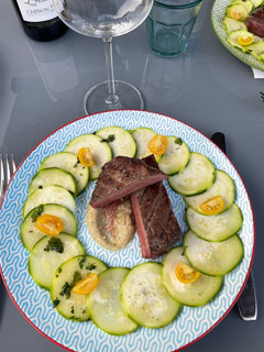 A picture of Zucchini Carpaccio with Beef and Eggplant Sauce.