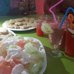 A picture of Plain cookies and watermelon juice.