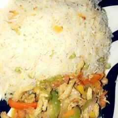A picture of Rice and vegetable sauce.