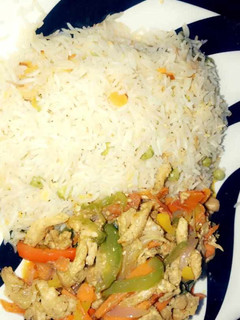 A picture of Rice and vegetable sauce.