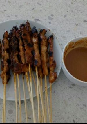A picture of Chicken Satay (Sate Ayam) with Peanut Sauce.