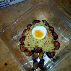 A picture of Indomie Veggies,fried plantain and boiled eggs.