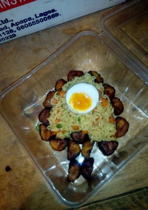 A picture of Indomie Veggies,fried plantain and boiled eggs.