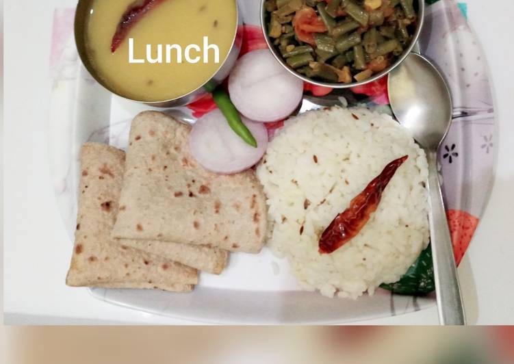 Toovar dal, lobia dry bhaji, chapatis jeera rice and slice onion