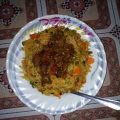 A picture of Fried rice and paper meat.