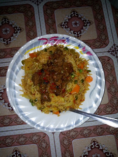A picture of Fried rice and paper meat.
