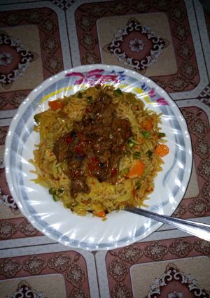 A picture of Fried rice and paper meat.