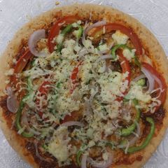A picture of Onion capcicum tomato pizza.