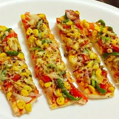 A picture of Corn Capsicum Pizza Bites.