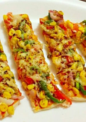 A picture of Corn Capsicum Pizza Bites.
