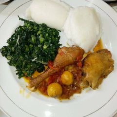 A picture of Stewed Kienyeji Chicken Ugali and Spinach.