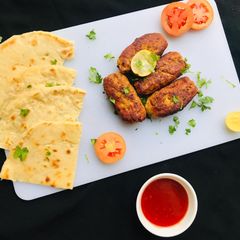 A picture of Turkish Adana Kebab With Bread.