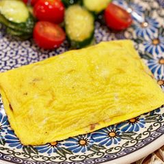 A picture of Simple omlet with minced meat and onions.