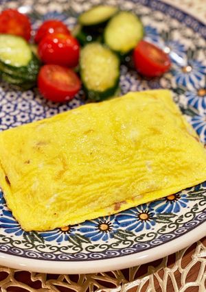A picture of Simple omlet with minced meat and onions.