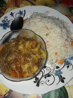 A picture of Wite rice with garbage soup.