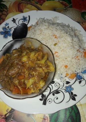 A picture of Wite rice with garbage soup.