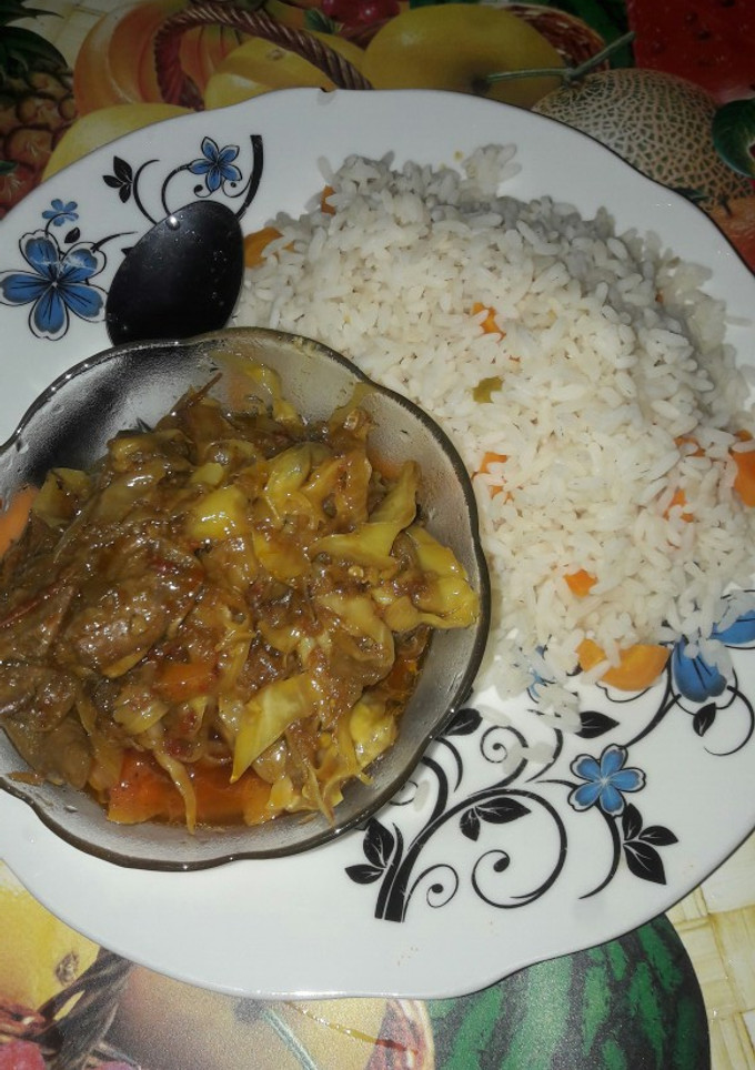 A picture of Wite rice with garbage soup.