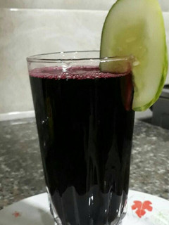 A picture of Zobo drink with pineapple and cucumber.