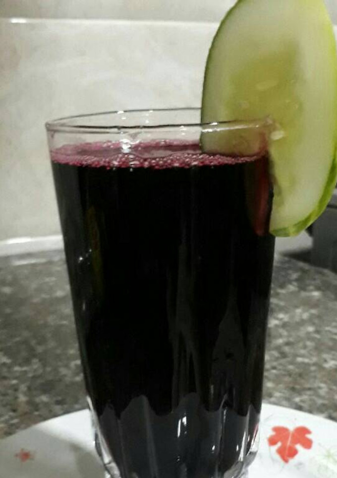 A picture of Zobo drink with pineapple and cucumber.