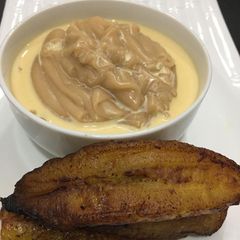 A picture of Brown pap and fried plantain.
