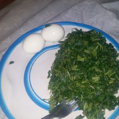 A picture of Plain spinach and boiled egg.