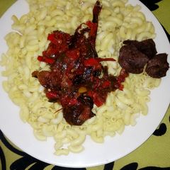 A picture of Yello macaroni with dry cat fish sauce.