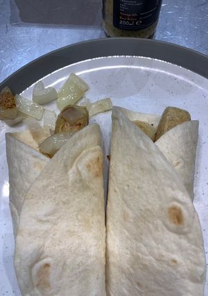 A picture of Sausage and onion wrap.
