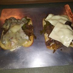 A picture of Yummy Philly cheese steaks.