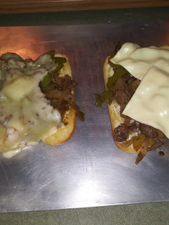 A picture of Yummy Philly cheese steaks.