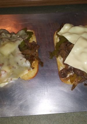 A picture of Yummy Philly cheese steaks.