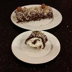 Chocolate Cake Roll With Coconut Cream Filling A picture of Chocolate Cake Roll With Coconut Cream Filling.