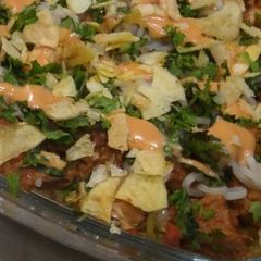 A picture of Chicken tikka masala layered rice.