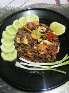 A picture of Thai Style Fried Rice with Egg and Sausages.