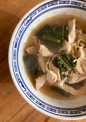 A picture of Poached chicken and ginger broth.