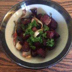 A picture of Roasted beetroot with onion, garlic, oregano and parsley.
