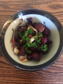 A picture of Roasted beetroot with onion, garlic, oregano and parsley.