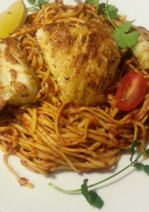 A picture of Chilean Seabass with Pasta in Marinara Sauce.