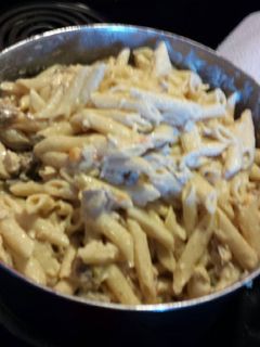 A picture of Pasta w/pork sausage, chicken and veggies.
