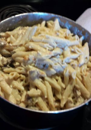 A picture of Pasta w/pork sausage, chicken and veggies.