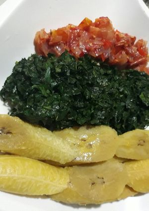 A picture of Boiled ripe plantain with vegetable and tomatoes sauce.