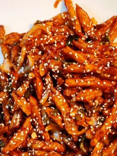 A picture of Honey fried fries with sesame.