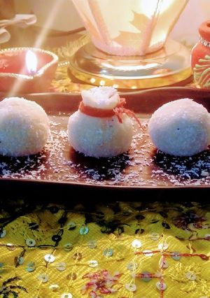 A picture of Coconut laddu made from milk and desiccated coconut Powder.