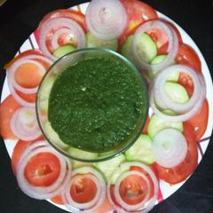 A picture of Green Chutney with Salad.