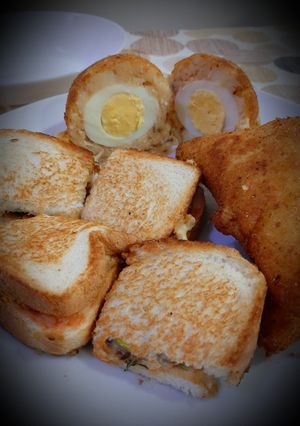 A picture of Shami Sandwich with potato egg balls.