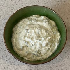 A picture of Tzatziki (yoghurt and cucumber dip).